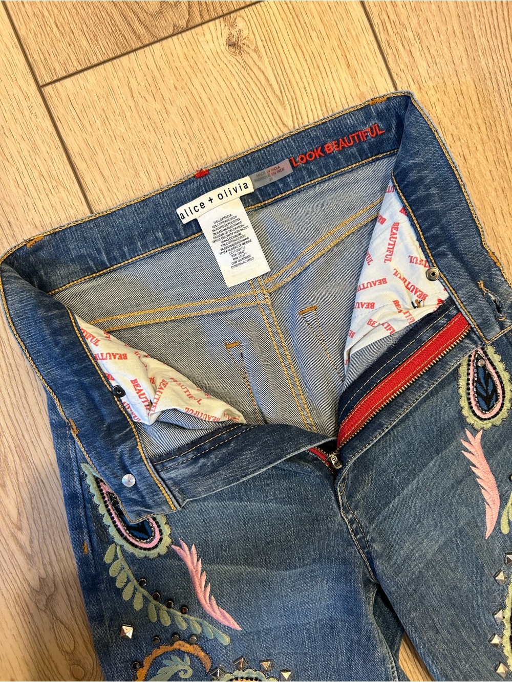 Alice + Olivia Denim Flare Jeans with Multicolor Paisley Embroidery - Picture 9 of 16